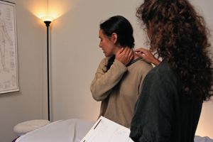 Woman showing a nurse her neck