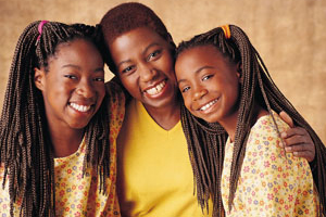 Picture of a teen, a young girl, and their mother