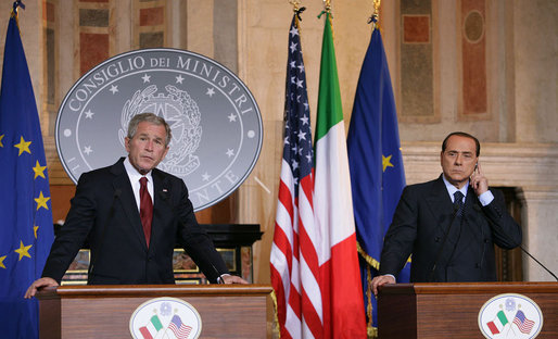 President George W. Bush and Italian Prime Minister Silvio Berlusconi listen to a reporter's question during their joint press availability Thursday, June 12, 2008, at the Villa Madama in Rome. White House photo by Chris Greenberg