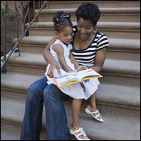 Photo: A mother reading to her daughter