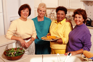 A picture of four women in a kitchen