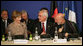 Mrs. Laura Bush, seated next to Afghanistan Foreign Minister Dr. Rangin Dadfar Spanta, speaks with Afghanistan President Hamid Karzai, right, during the International Conference in Support of Afghanistan Thursday, June 12, 2008, in Paris. White House photo by Shealah Craighead