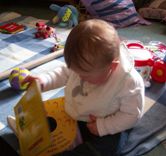 Baby reading a book