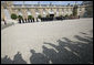 The media's shadow drops across the courtyard of the Elysée Palace in Paris Saturday, June 14, 2008, as the honor cordon and color guard prepare for the arrival of President George W. Bush, who spent the morning with France's President Nicolas Sarkozy. White House photo by Chris Greenberg