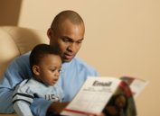 man reading to child