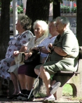 Elderly women sitting on a park bench