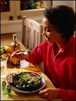 a picture of a woman eating healthy food