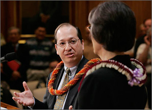 A close-up photograph of Assistant Secretary Alexander Karsner, wearing a lei, speaking with Hawaii Governor Linda Lingle.