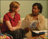 Photo: A woman consulting a healthcare professional.