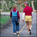 a man and woman walking.