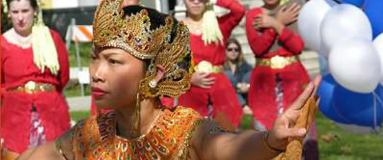 Photo of a young lady performing an Indonesian dance.