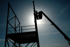 Marines inspect the metal frame of a new air traffic control tower. Combat engineers with Marine Wing Support Squadron 272 are currently constructing an air traffic control tower to create a better working environment for its air traffic controllers. Photo by: Sgt. Wayne Edmiston.