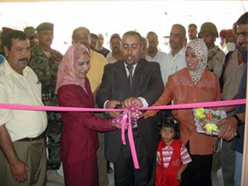 Local leaders cut the ribbon signifying the opening of the Salman Pak Girls Secondary School, April 24, in Salman Pak, Iraq.