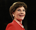 Image of Mrs. Laura Bush accepting Woman's Day Magazine Red Dress Award