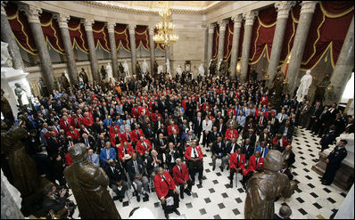 President George W. Bush and Speaker of the House of Representatives Nancy Pelosi stand amidst 300 Tuskegee Airmen during a photo opportunity Thursday, March 29, 2007, in Statuary Hall at the U.S. Capitol. White House photo by Joyce Boghosian