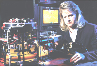 , NASA engineer Zena Hester of the Microgravity Research program, monitors a test run of an experiment designed to predict the formation of tiny tree-like crystals important to the study of physical properties of materials