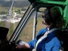 Pilot in Helicopter over Land
