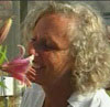 Senior woman smelling flower