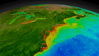 This animation begins with a wide shot of the United States and zooms down to the Northeastern seaboard of the United States while cycling through nearly ten years of SeaWiFS biosphere data.