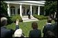 After welcoming the new members of Iraq's interim government, President George W. Bush answers questions from the press in the Rose Garden Tuesday, June 1, 2004.  White House photo by Eric Draper