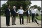 Standing with his national defense team, President George W. Bush talks with the press at Prairie Chapel Ranch in Crawford, Texas, Monday, Aug. 23, 2004. Pictured, from left, are: Dr. Condoleezza Rice, Vice President Dick Cheney, Secretary of Defense Donald Rumsfeld and Chairman of the Joint Chiefs of Staff General Richard Meyers.  White House photo by Paul Morse