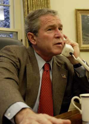 Calling world leaders, from the Oval Office, concerning the capture of Saddam Hussein, December 14.