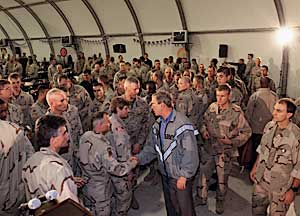 Greeting U.S. troops during Thanksgiving dinner at the Bob Hope Dining Facility in Baghdad, Iraq, November 27.