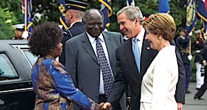 Greeting President Mwai Kibaki of Kenya and his wife, Lucy Kibaki, during an arrival ceremony on the South Lawn, October 6.