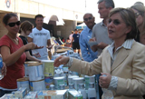 Senator Boxer talks with volunteers about the donations of food at the San Diego evacuation center