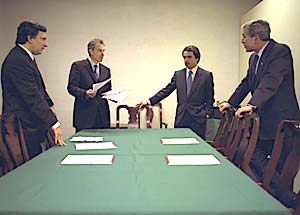 Conferring with Prime Minister Tony Blair of Great Britain, President Jose Maria Aznar of Spain, and Prime Minister Jose Manual Durao Barraso of Portugal in the Azores, Portugal, March 16.