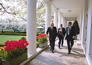 With Vice President Dick Cheney and Chief of Staff Andrew H. Card, Jr., on the Colonnade, April 16.