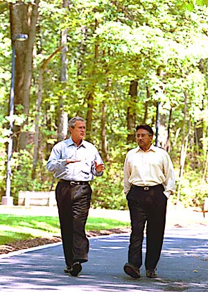 With President Pervez Musharraf of Pakistan on the grounds of Camp David, MD, June 24.