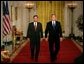 President George W. Bush walks with his Supreme Court Justice Nominee John Roberts before delivering the announcement on the State Floor of the White House, Tuesday evening, July 19, 2005.  White House photo by Eric Draper