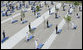 Military personnel stand at attention behind each of the 184 memorial benches draped in ceremonial cloths Thursday, Sept. 11, 2008, during the dedication of the 9/11 Pentagon Memorial at the Pentagon in Arlington, Va. White House photo by Chris Greenberg