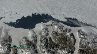 Animation zooms to view the ice shelf from overhead and sequences through the satellite images showing the breakup.  The overlay shows the region of interest and the date and time.