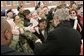 President George W. Bush greets people during a visit to Clinton Township, Mich., Friday, Jan. 7, 2005.  White House photo by Paul Morse