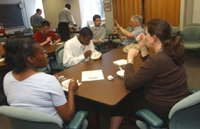 Photo if mentors and students eating ice cream.