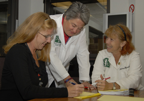 Mary Aiello, Karen Reynolds  and Dr. Debra Klamen, all Education and Curriculum, work on developing new patient safety components for the curriculum. 