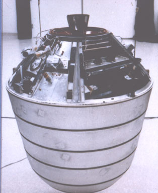 The intact space recovery vehicle before payload integration. The de-orbit rocket is visible at the top.
