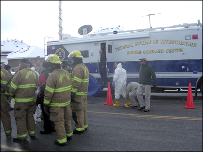 FBI personnel and others in front of the FBI Mobile Command Center