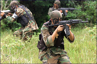 Paramilitary gunmen during a training session in Colombia.