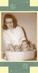 Mother bathing baby
