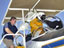 NASA Dryden life support technician Jim Sokolik assists pressure-suited pilot Dee Porter into the cockpit of NASA's ER-2 Earth resources aircraft.