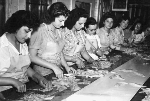 women cutting fish