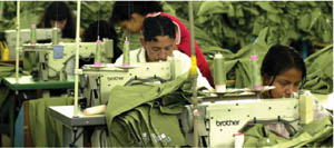 These workers sew at a maquila, or sweatshop in Central America.  Many Central Americans have been trafficked into forced labor situations, including sweatshops, where they toil under harsh conditions of indentured servitude. [AP Photo/Jaime Puebla]