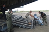 Louisiana National Guard and U.S. Air Force personnel board residents of New Orleans with special medical needs onto an Air Force C-17 Hercules aircraft at the Lakefront Airport as they prepare to evacuate the city prior to the arrival of Hurricane Gustav.  