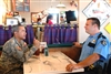 U.S. Army Lt. Gen. Charles G. Rodriguez, adjutant general of the Texas National Guard, talks with Port Arthur Police Officer Jim Dinger in Port Arthur, Texas, as they plan to take in evacuees from Hurricane Gustav, Aug. 31, 2008. 