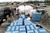 Mississippi Army National Guard troops provided nearly 1,000 returning Hurricane Gustav evacuees with bottled water and ice at a distribution point near Gulfport, Miss., Sept. 2, 2008. Citizens began returning Sept. 1 and 2 after Hurricane Gustav caused most of the region to evacuate to safer areas.