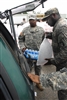 Mississippi Army National Guardsmen load up a vehicle with bottled water and ice for a needy Gulfport, Miss., resident Sept. 2, 2008, just outside the city. Citizens began returning after Hurricane Gustav caused most of the region to evacuate to safer areas.