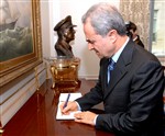 SIGNING THE GUESTBOOK - Click for high resolution Photo